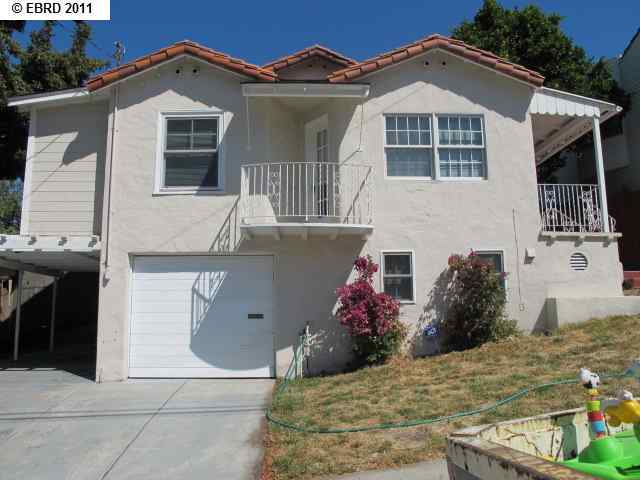 820 Fourth Street Rodeo, CA 94572 - Photo 1 of 1 a front view of a house with a yard