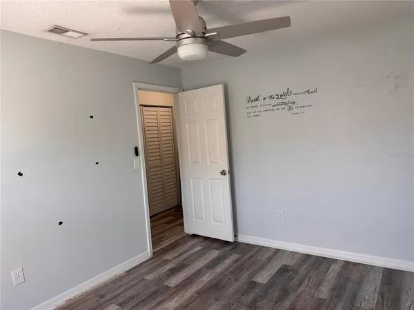 a view of an entryway with wooden floor