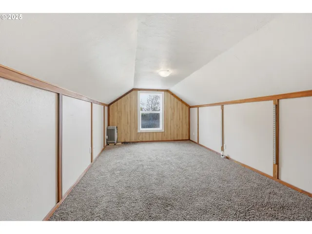a view of a big room with windows and closet