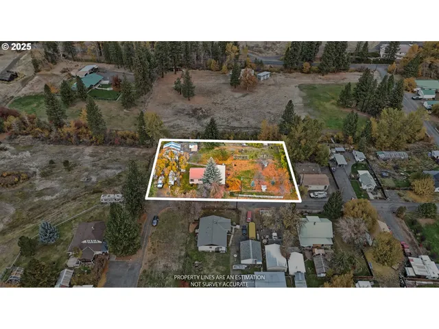 a aerial view of a house with a yard