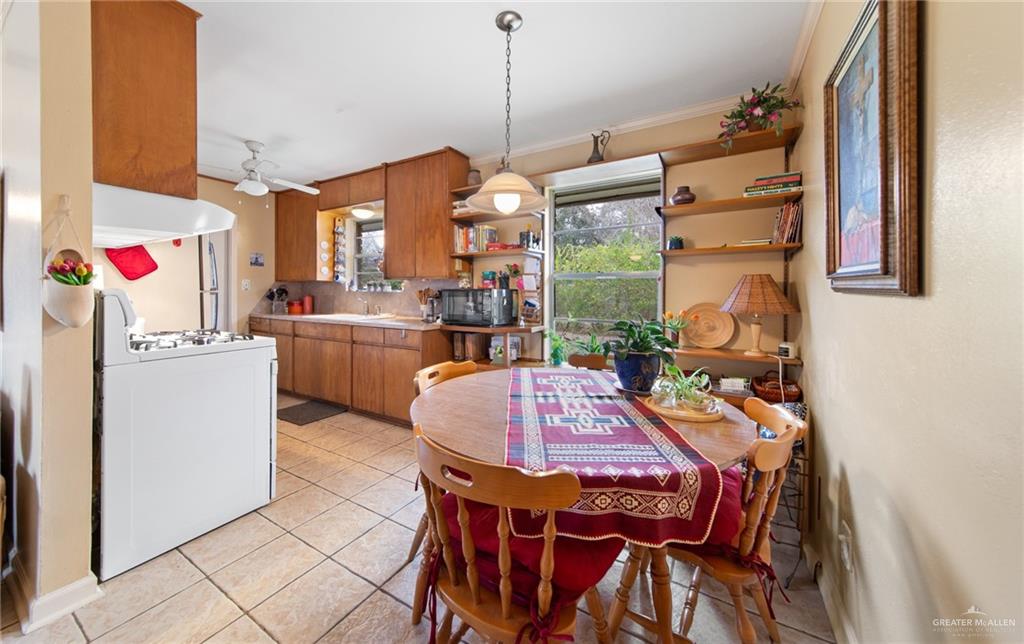 1012 West 3rd Street Weslaco, TX 78596 - Photo 12 of 27 a dinning table and chairs in a room