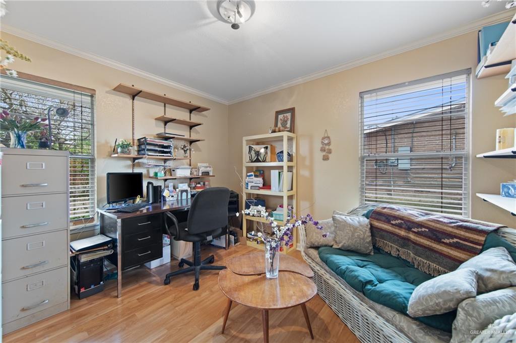 1012 West 3rd Street Weslaco, TX 78596 - Photo 16 of 27 a view of a livingroom with workspace and a window