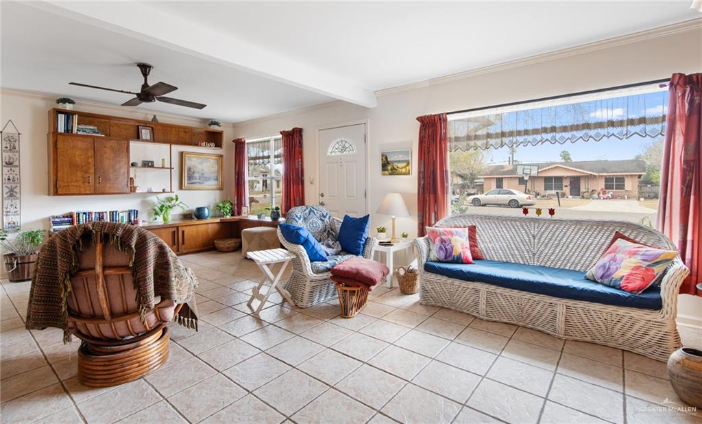 1012 West 3rd Street Weslaco, TX 78596 - Photo 7 of 27 a living room with furniture and a large window