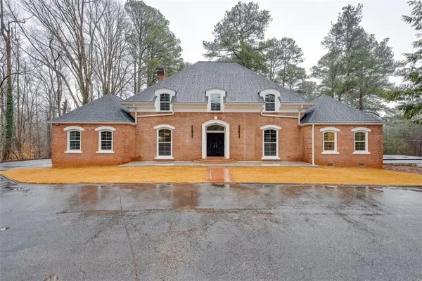 a view of a yard with large trees