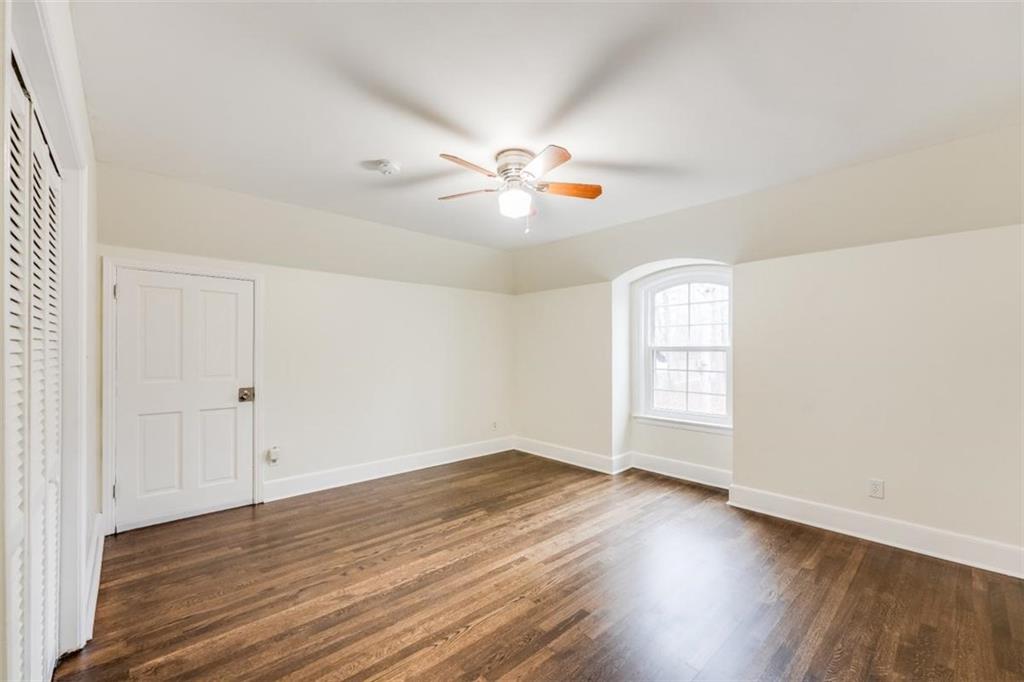 5550 Koweta Road South Fulton, GA 30349 - Photo 11 of 58 an empty room with wooden floor and windows