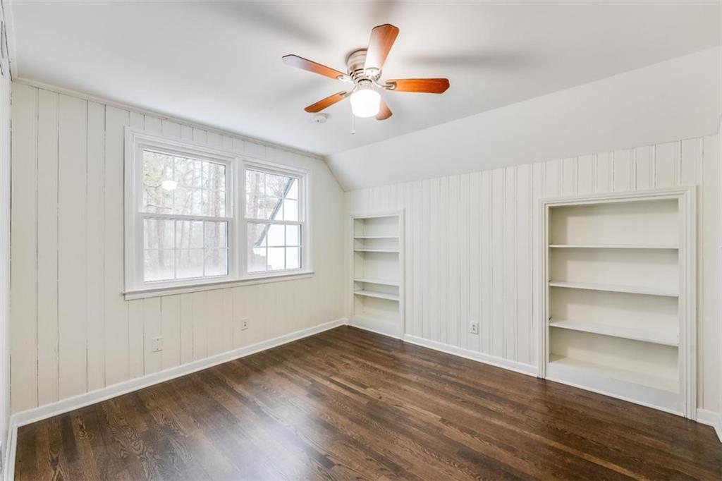 5550 Koweta Road South Fulton, GA 30349 - Photo 12 of 58 a view of an empty room with a window and wooden floor