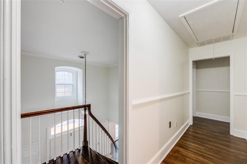 5550 Koweta Road South Fulton, GA 30349 - Photo 13 of 58 a view of a hallway with wooden floor and staircase