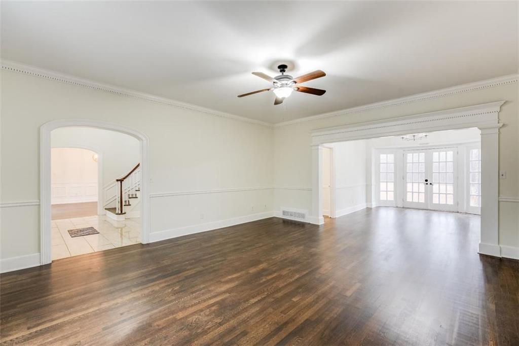 5550 Koweta Road South Fulton, GA 30349 - Photo 15 of 58 a view of empty room with wooden floor and fan