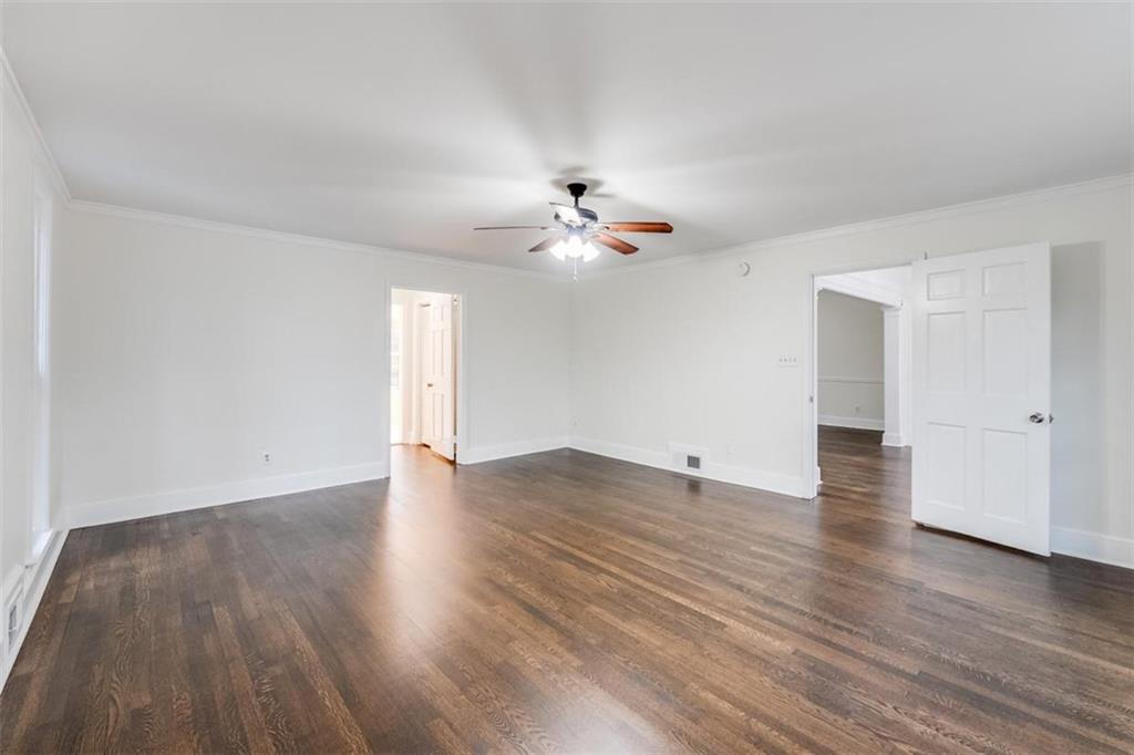 5550 Koweta Road South Fulton, GA 30349 - Photo 19 of 58 a view of an empty room and wooden floor