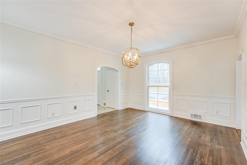 5550 Koweta Road South Fulton, GA 30349 - Photo 27 of 58 an empty room with wooden floor and windows