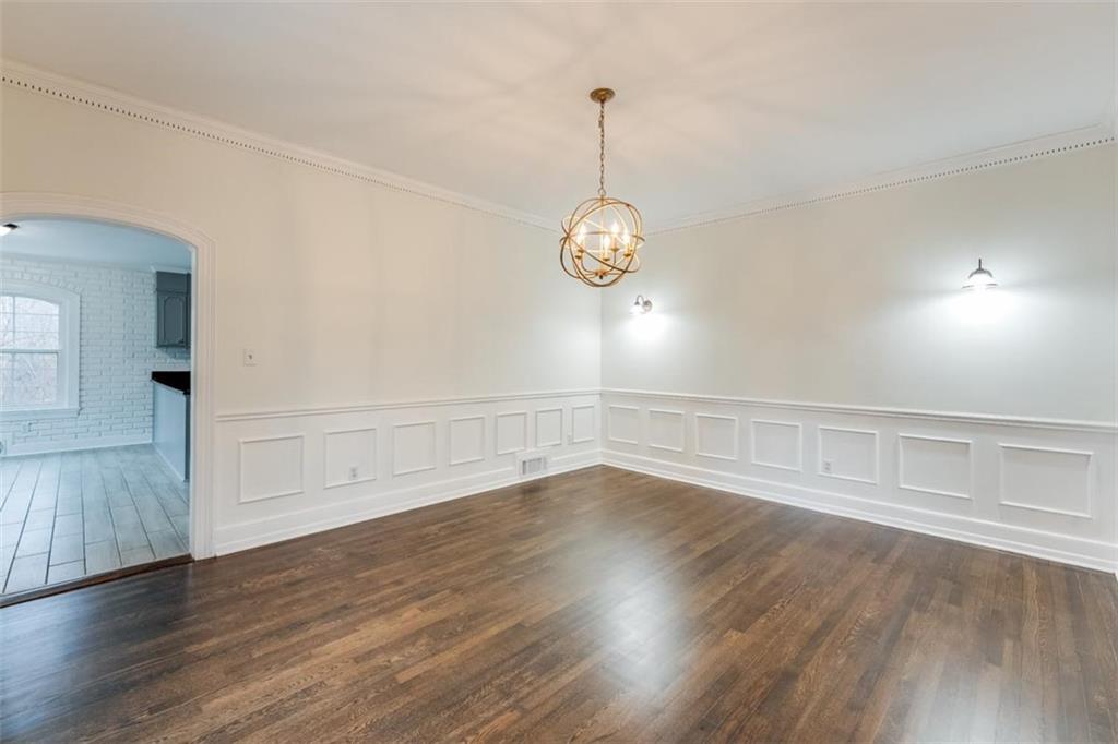 5550 Koweta Road South Fulton, GA 30349 - Photo 28 of 58 a view of an empty room with wooden floor and a window