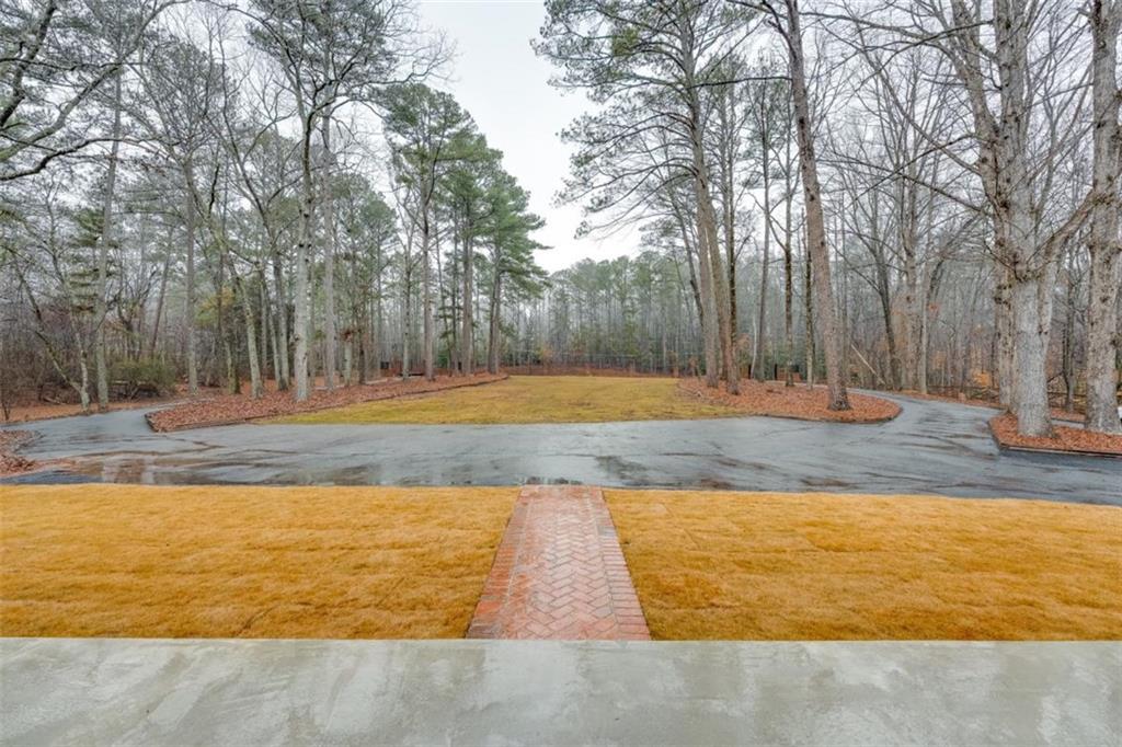 5550 Koweta Road South Fulton, GA 30349 - Photo 3 of 58 a view of a yard with large trees