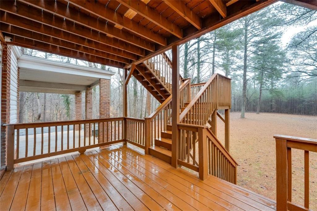 5550 Koweta Road South Fulton, GA 30349 - Photo 31 of 58 a view of balcony with wooden floor and fence