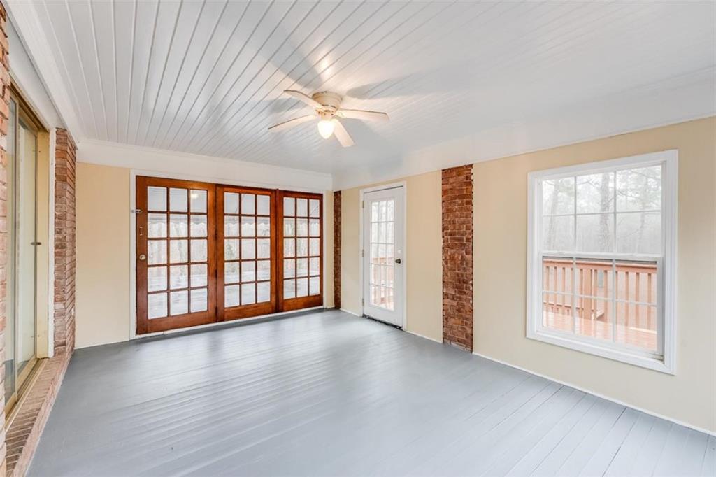 5550 Koweta Road South Fulton, GA 30349 - Photo 36 of 58 a view of an empty room with a window and wooden floor