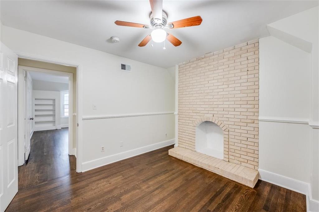 5550 Koweta Road South Fulton, GA 30349 - Photo 39 of 58 an empty room with wooden floor and chandelier fan