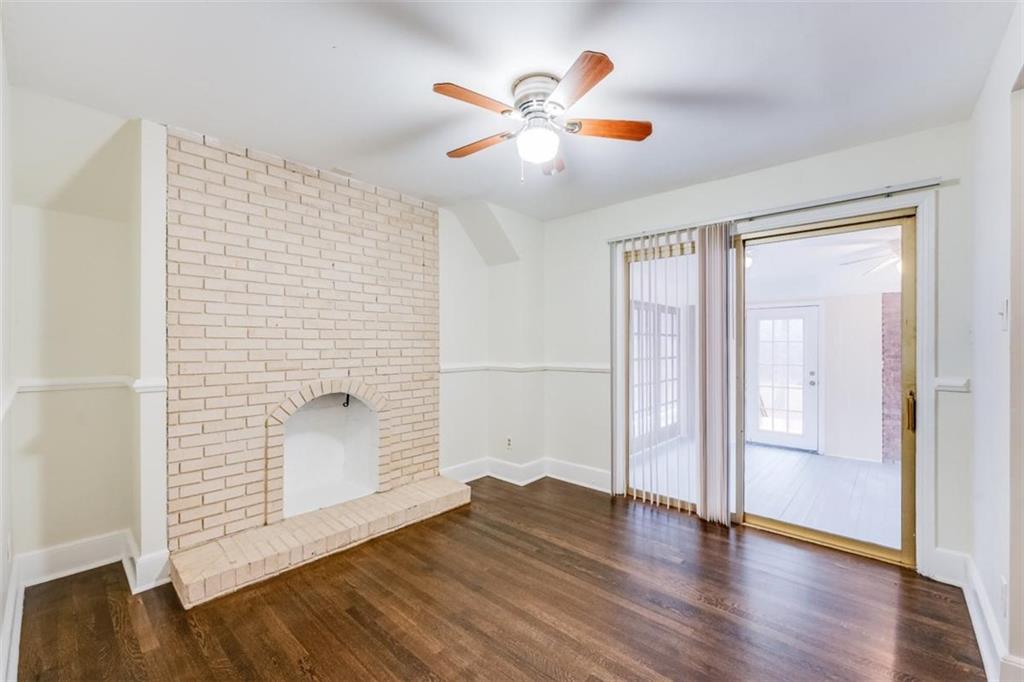5550 Koweta Road South Fulton, GA 30349 - Photo 42 of 58 an empty room with wooden floor and door