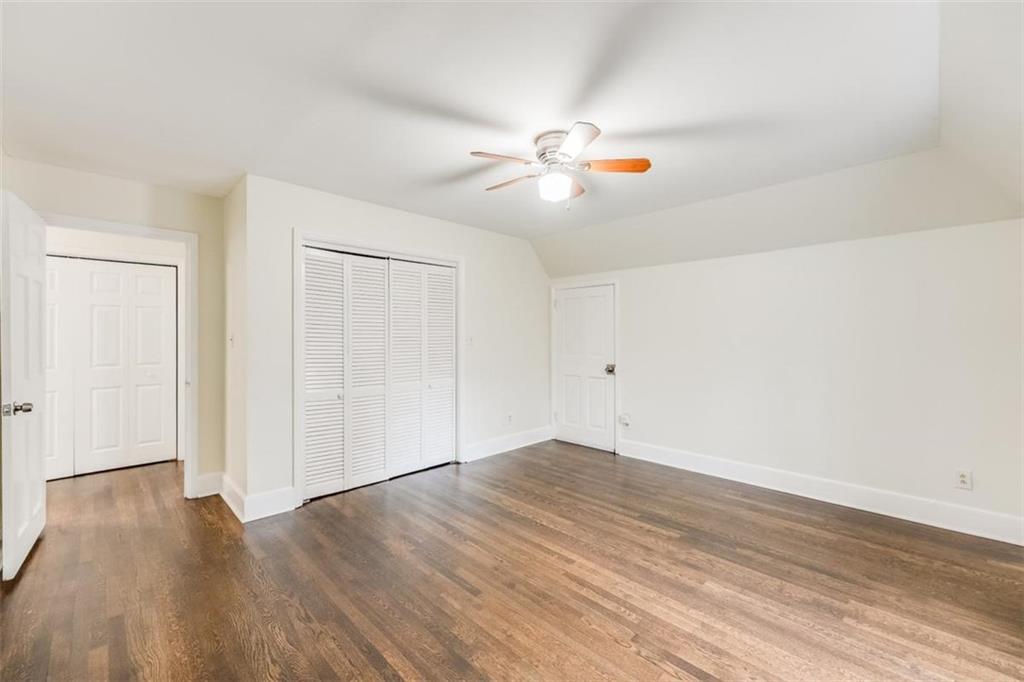 5550 Koweta Road South Fulton, GA 30349 - Photo 7 of 58 a view of empty room with wooden floor and fan