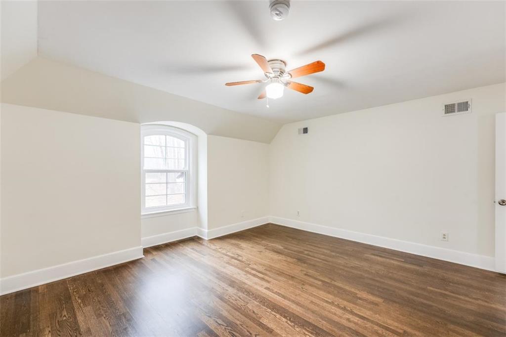 5550 Koweta Road South Fulton, GA 30349 - Photo 8 of 58 an empty room with wooden floor and window