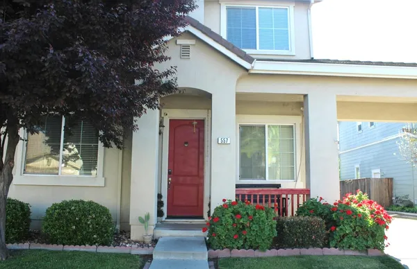 a front view of a house with a yard