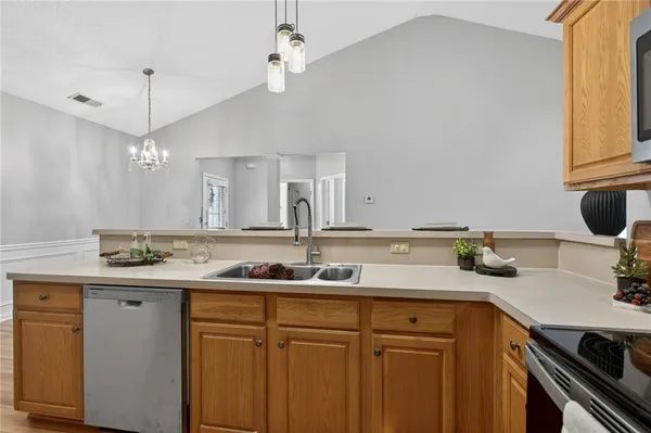 a kitchen with a sink and cabinets