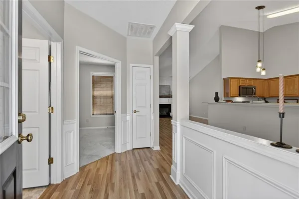 a view of a kitchen from the hallway