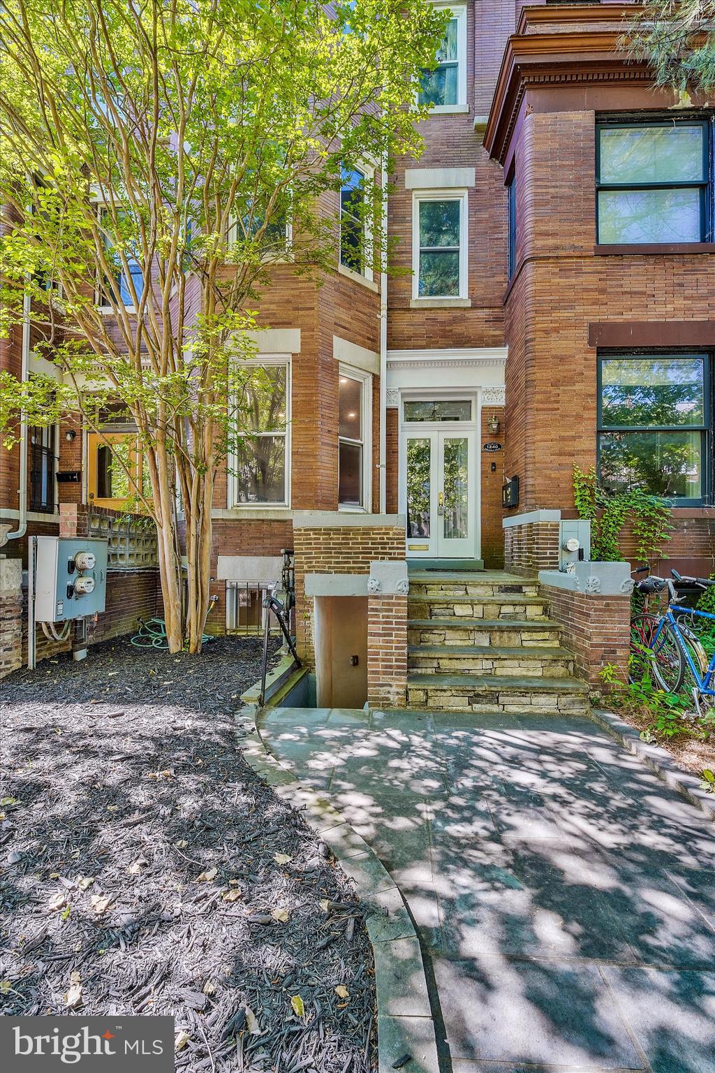 1240 Columbia Road Northwest, Unit 1 Washington, DC 20009 - Photo 18 of 25 a view of a house with a yard