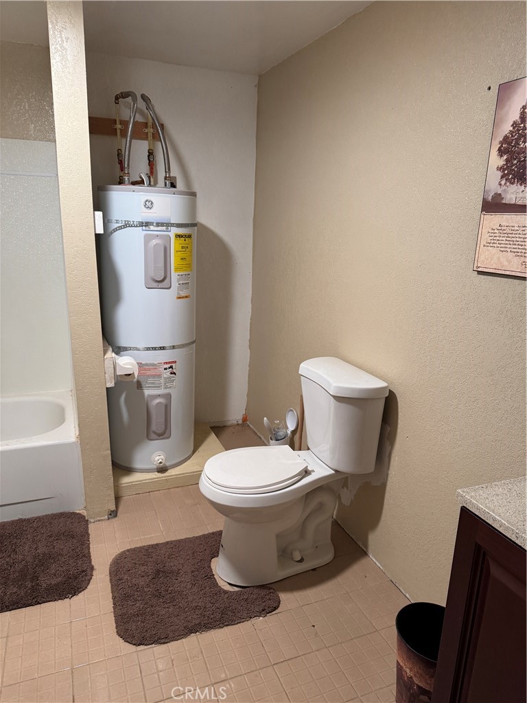 3110 Wilson Road Twentynine Palms, CA 92277 - Photo 17 of 34 a bathroom with a toilet sink and mirror