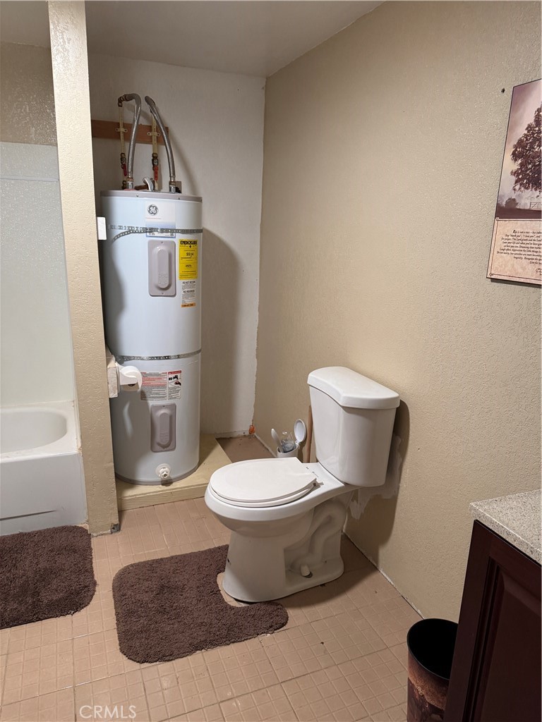 3110 Wilson Road Twentynine Palms, CA 92277 - Photo 18 of 34 a bathroom with a toilet sink and mirror