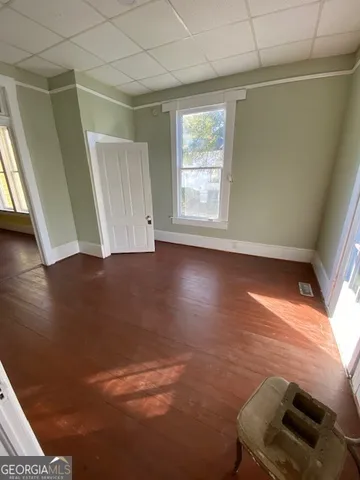 a view of room with window and hardwood floor