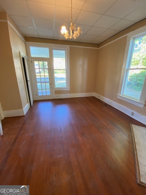 252 Edwards Street Elberton, GA 30635 - Photo 15 of 43 an empty room with wooden floor and windows