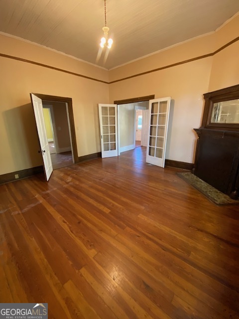 252 Edwards Street Elberton, GA 30635 - Photo 18 of 43 an empty room with wooden floor and windows