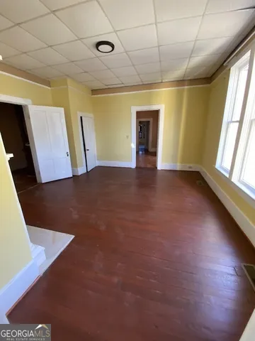 a view of empty room with a fireplace