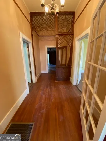 a view of entryway with wooden floor