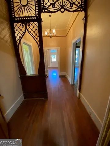 a view of an entryway with wooden floor