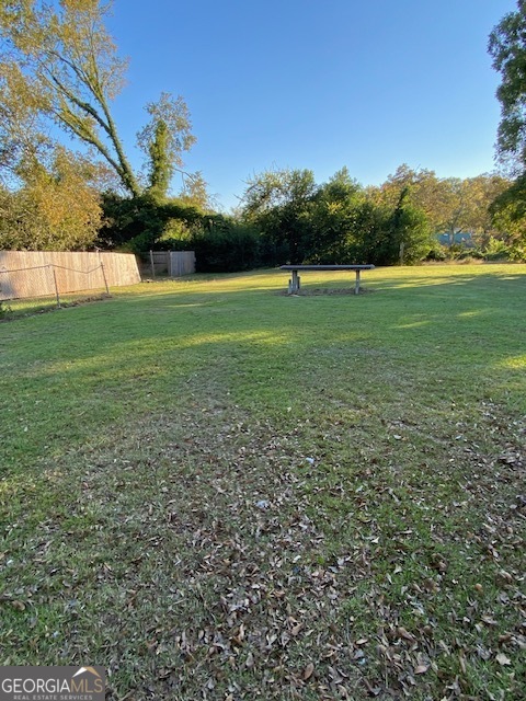 252 Edwards Street Elberton, GA 30635 - Photo 31 of 43 a view of outdoor space with green field and trees all around