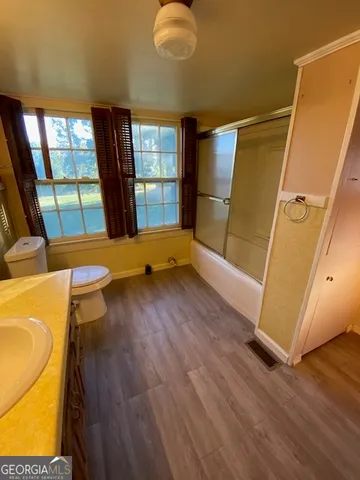 a view of a storage & utility room with wooden floor