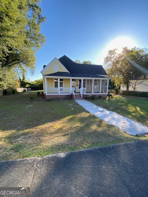 252 Edwards Street Elberton, GA 30635 - Photo 5 of 43 a view of a yard in front of a house