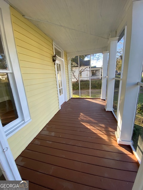 252 Edwards Street Elberton, GA 30635 - Photo 9 of 43 a view of a balcony with wooden floor and stairs