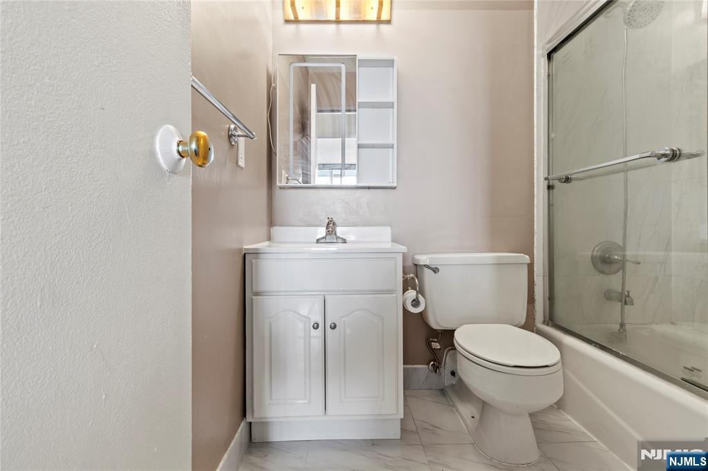 250 Gorge Road, Unit 18K Cliffside Park, NJ 07010 - Photo 13 of 30 a bathroom with a sink toilet and shower