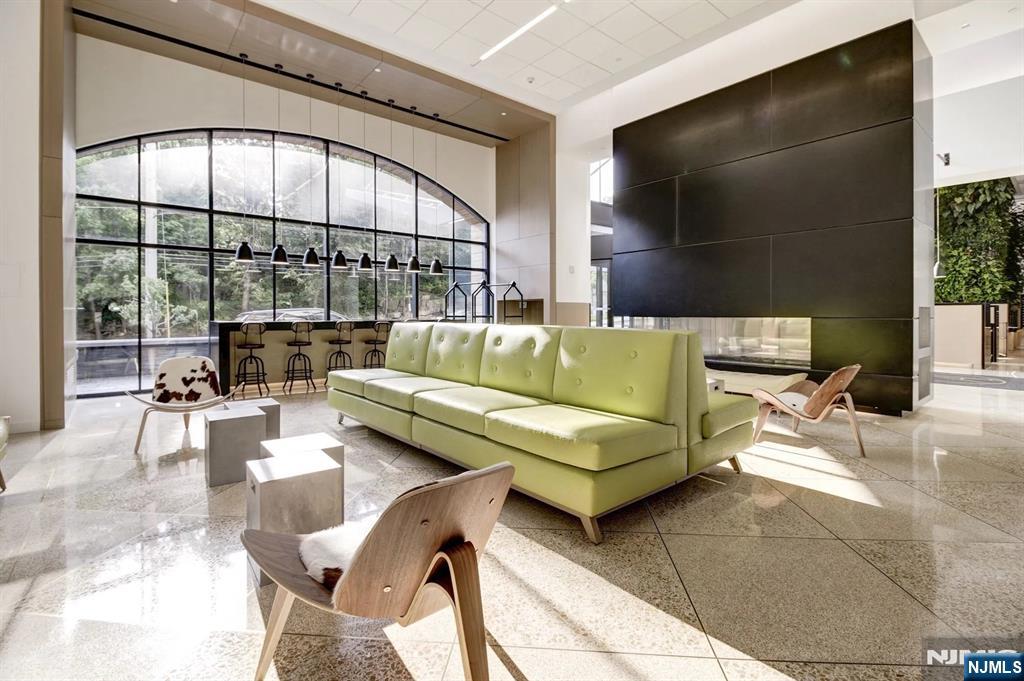 250 Gorge Road, Unit 18K Cliffside Park, NJ 07010 - Photo 22 of 30 a living room with furniture and a large window