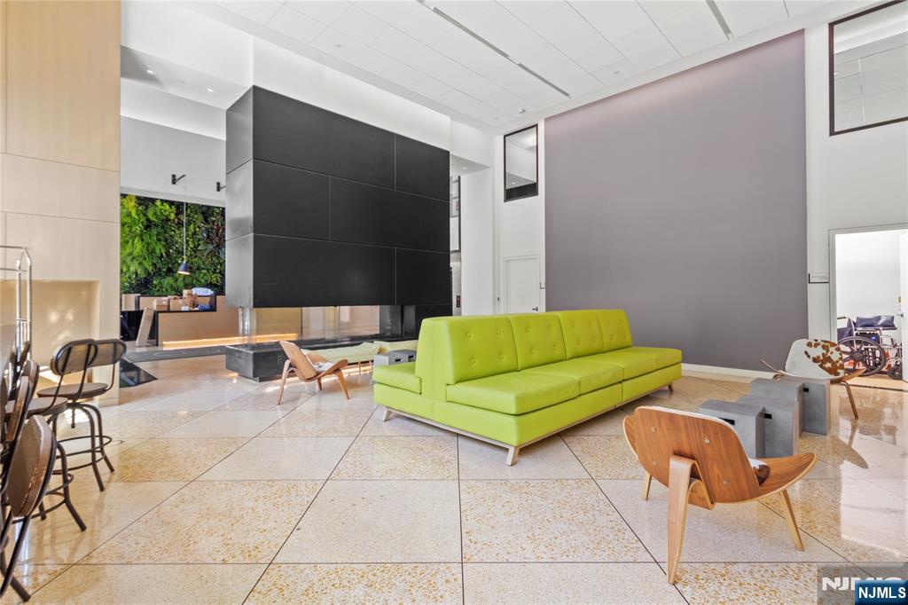 250 Gorge Road, Unit 18K Cliffside Park, NJ 07010 - Photo 23 of 30 a living room with furniture and a flat screen tv