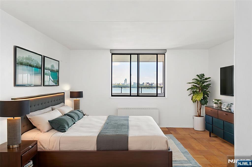 250 Gorge Road, Unit 18K Cliffside Park, NJ 07010 - Photo 9 of 30 a bedroom with a bed table and window