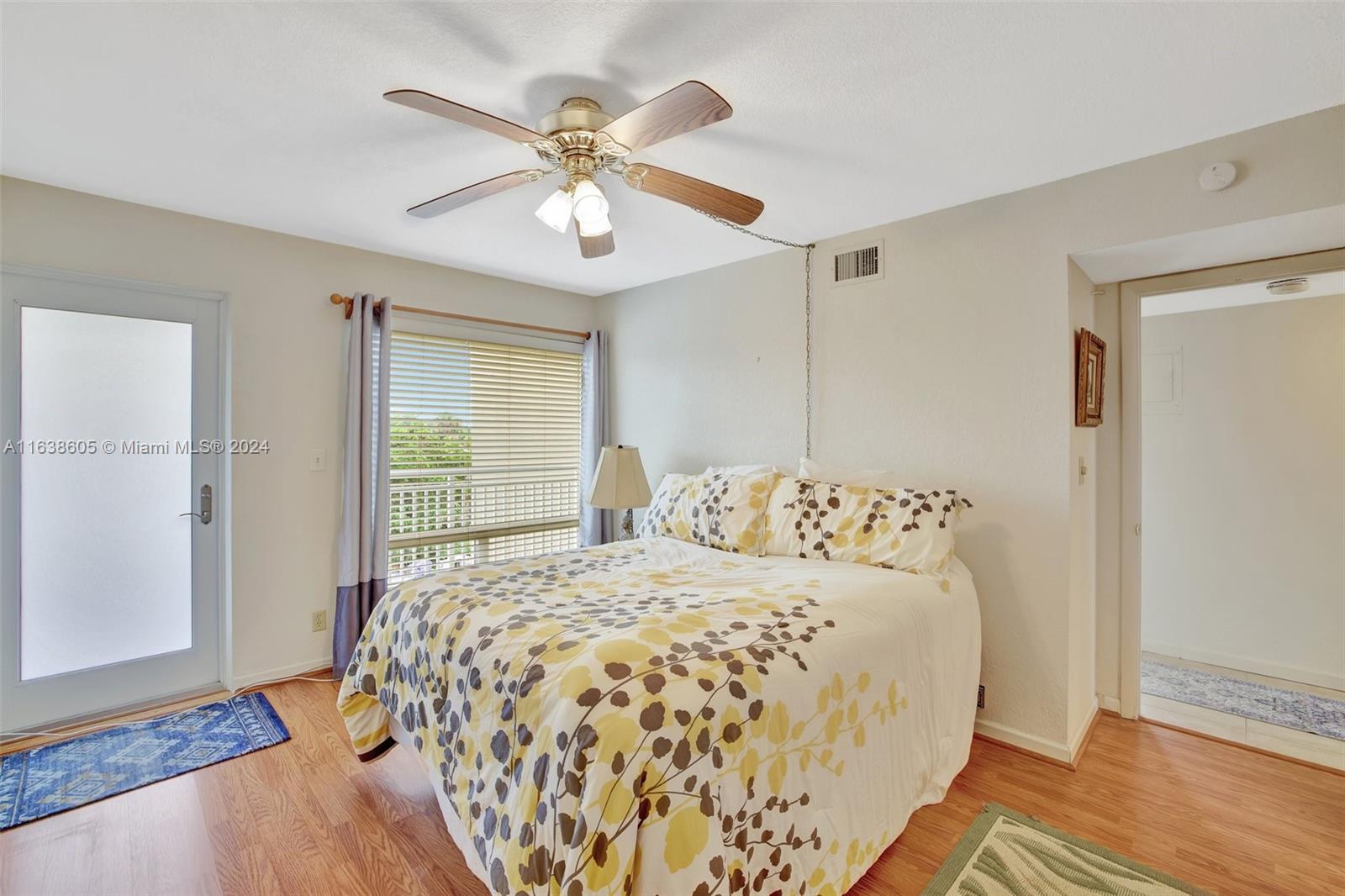 2611 North Riverside Drive, Unit 301 Pompano Beach, FL 33062 - Photo 14 of 31 a bedroom with a large bed and a window
