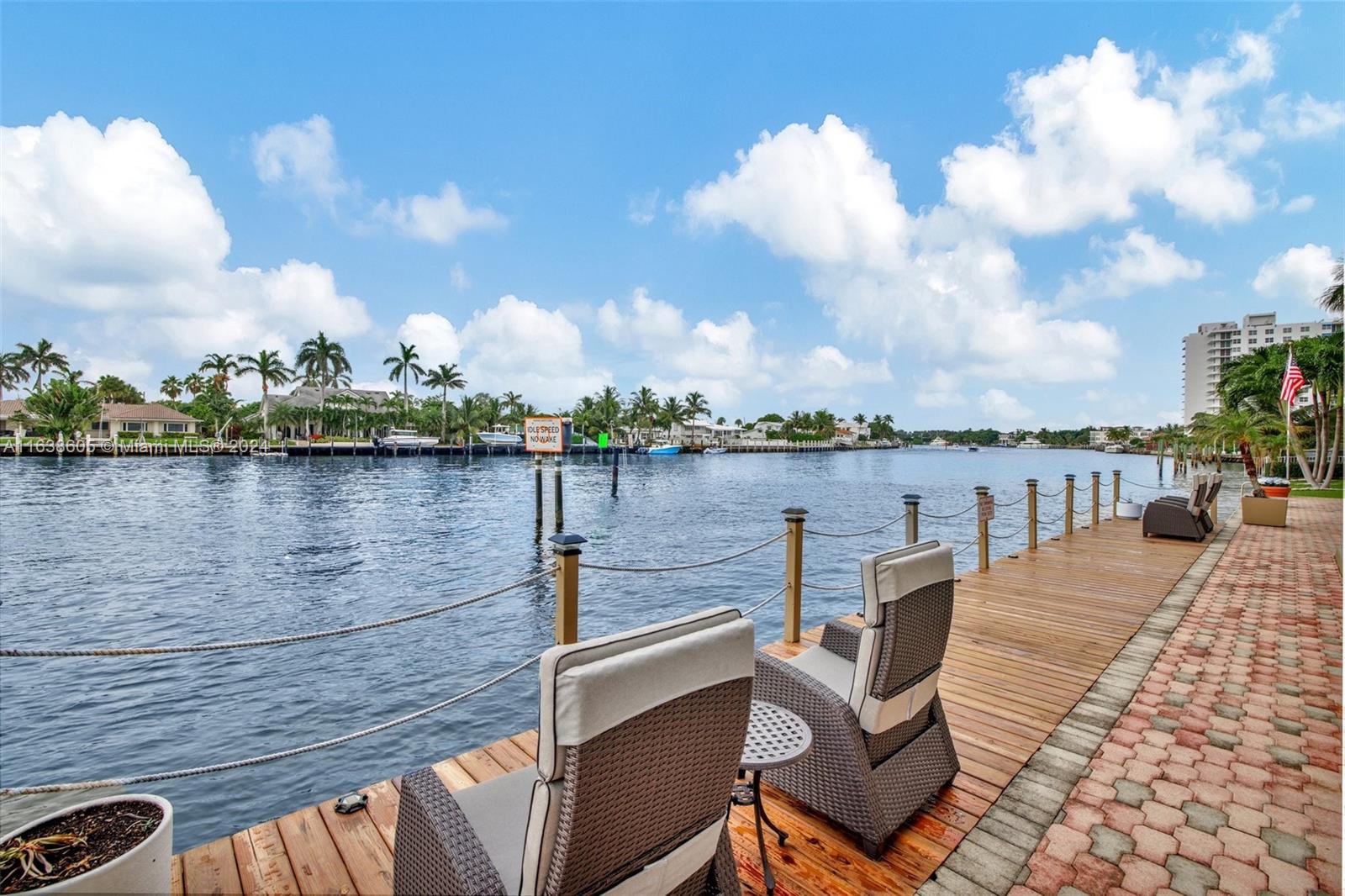 2611 North Riverside Drive, Unit 301 Pompano Beach, FL 33062 - Photo 17 of 31 a view of a lake with sitting area