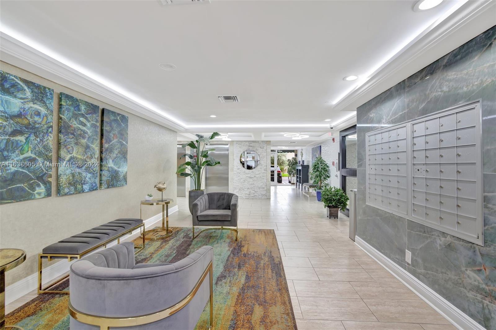 2611 North Riverside Drive, Unit 301 Pompano Beach, FL 33062 - Photo 22 of 31 a living room with furniture and a potted plant
