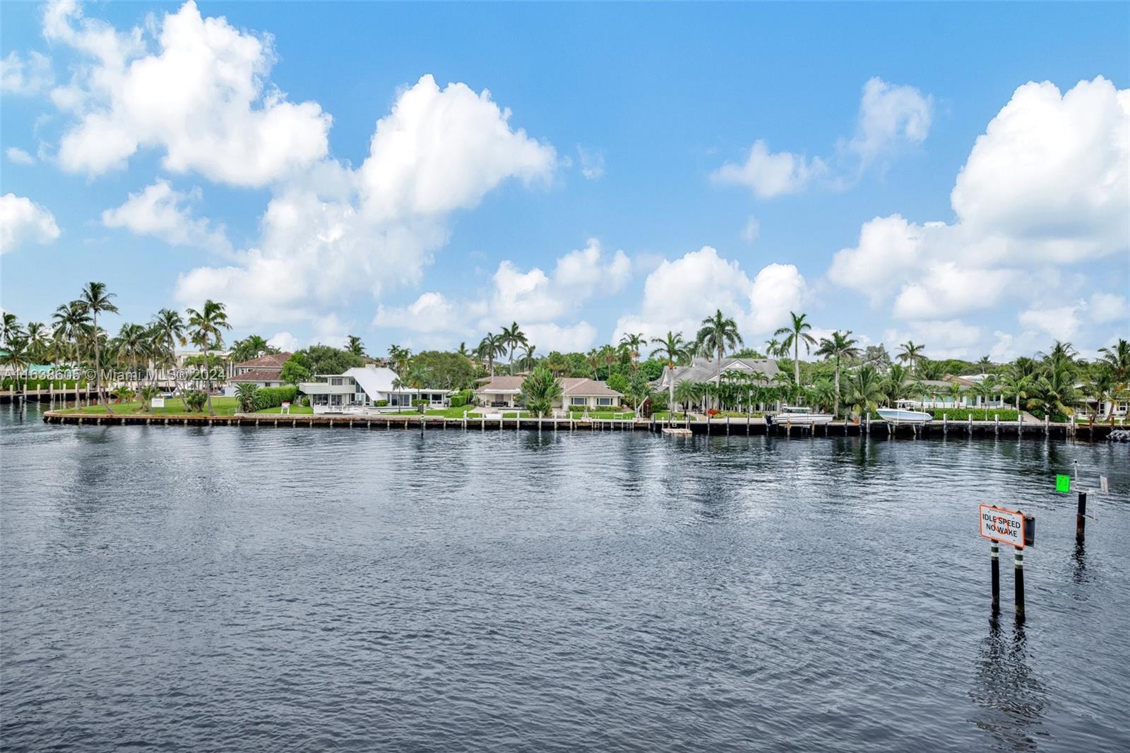 2611 North Riverside Drive, Unit 301 Pompano Beach, FL 33062 - Photo 3 of 31 a view of a lake with a house