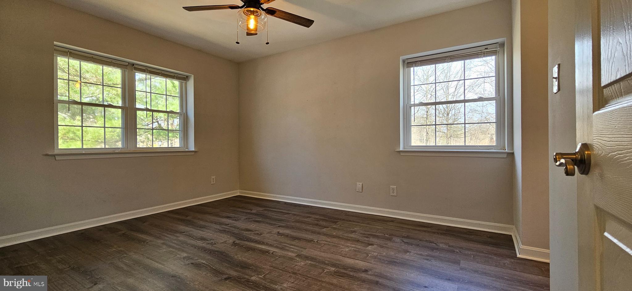 5831 Cove Landing Road, Unit 301 Burke, VA 22015 - Photo 13 of 33 an empty room with a window and ceiling fan