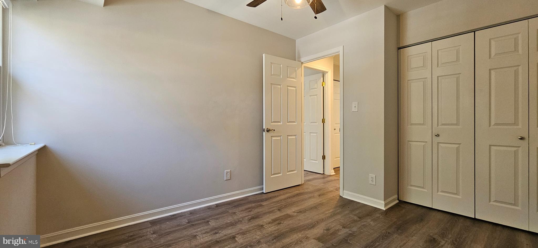 5831 Cove Landing Road, Unit 301 Burke, VA 22015 - Photo 21 of 33 an empty room with wooden floor
