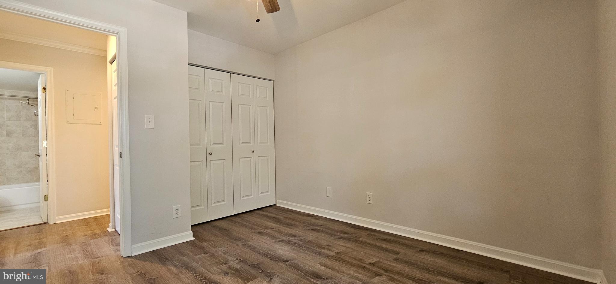 5831 Cove Landing Road, Unit 301 Burke, VA 22015 - Photo 22 of 33 a view of an empty room with wooden floor