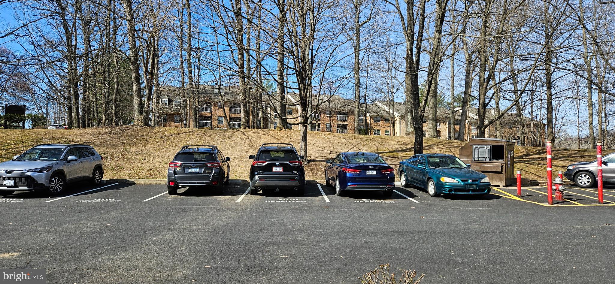 5831 Cove Landing Road, Unit 301 Burke, VA 22015 - Photo 29 of 33 a view of a cars parked in a parking lot at street